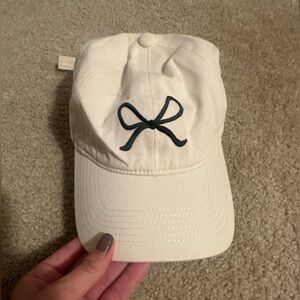 Cream Color Hat with Black Bow Emblem